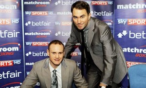 Eddie Hearn, right, poses with George Groves