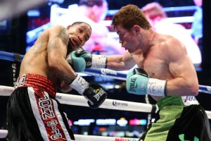 HOUSTON, TX - MAY 9: Saul "Canelo" Alvarez (black/green trunks) and James Kirkland (black/red trunks) during their 12 round super welterweight fight at Minute Maid Park on May 9, 2015 in Houston, Texas. (Photo by Ed Mulholland/Golden Boy/Golden Boy via Getty Images) *** Local Caption ***Saul Alvarez; James Kirkland